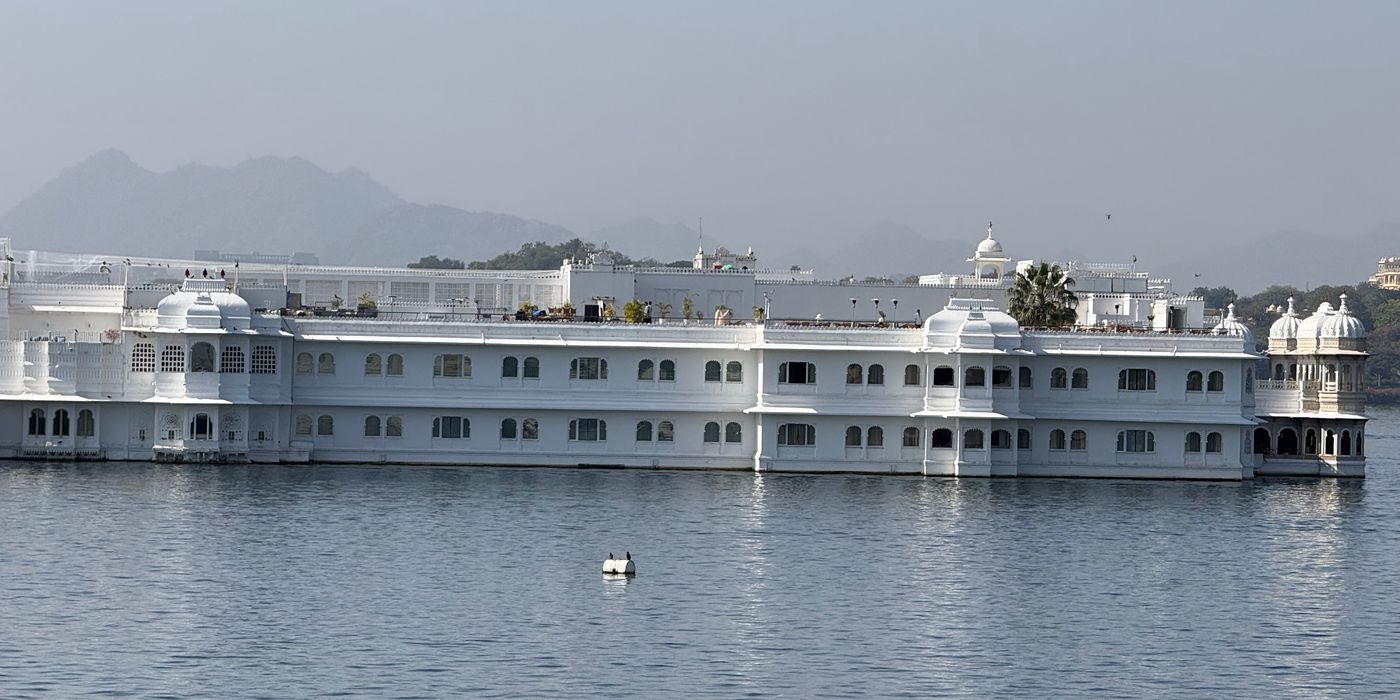 Majestic Lake Palace hotel reflecting on Pichola Lake in Udaipur, India